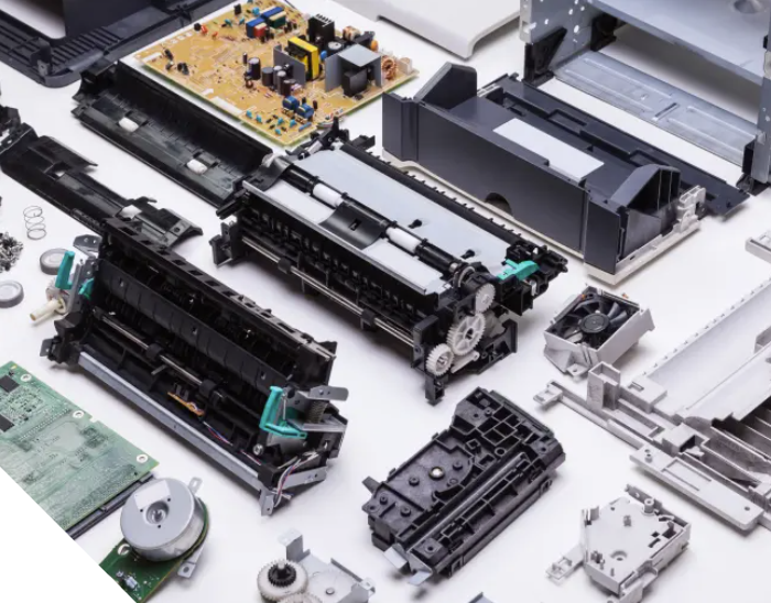 Disassembled office equipment components showing detailed hardware repair and maintenance